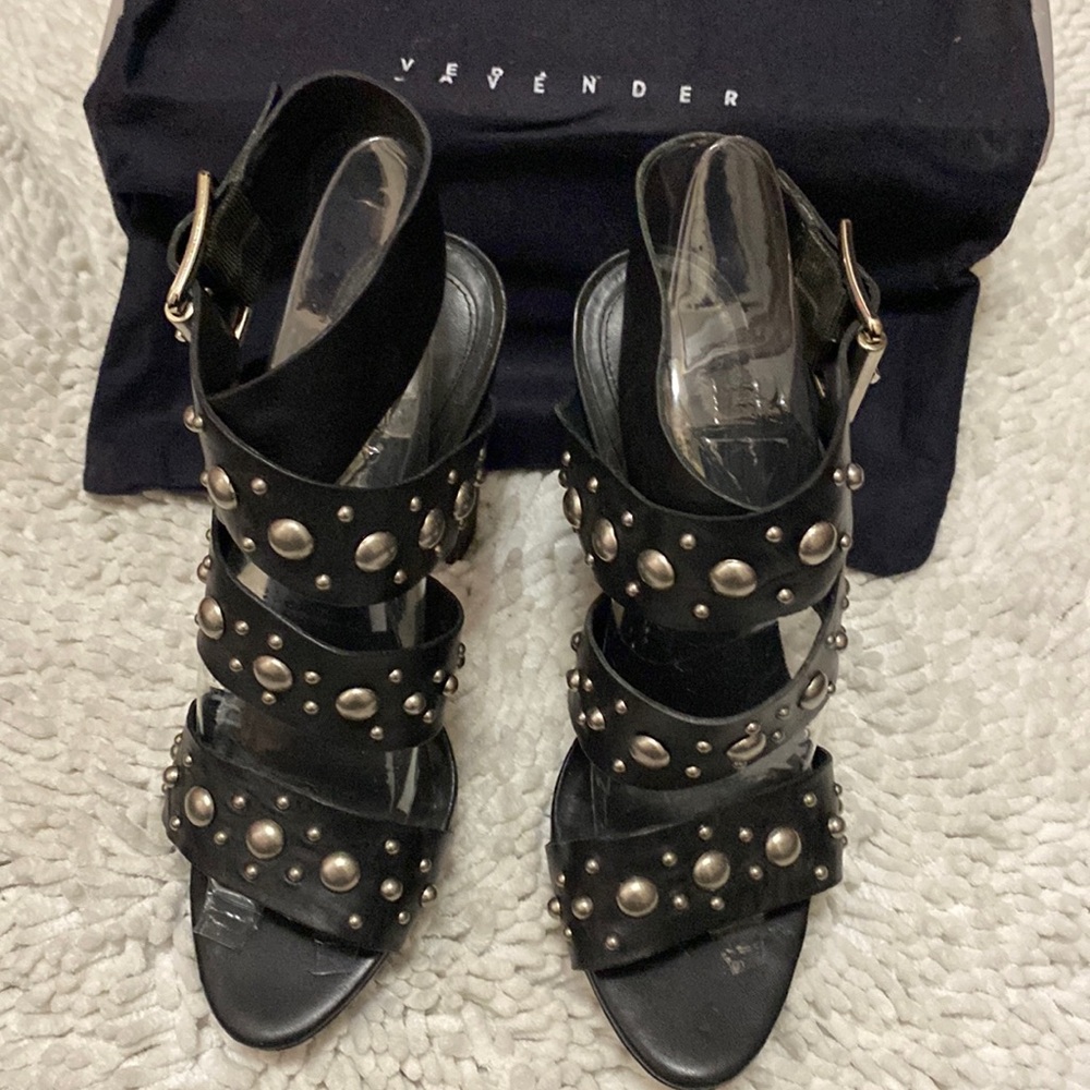 Vera Wang black leather platform sandals with silver stud detail.